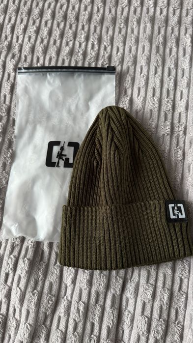 Нова шапка Олива Company Group Компані Груп Тім