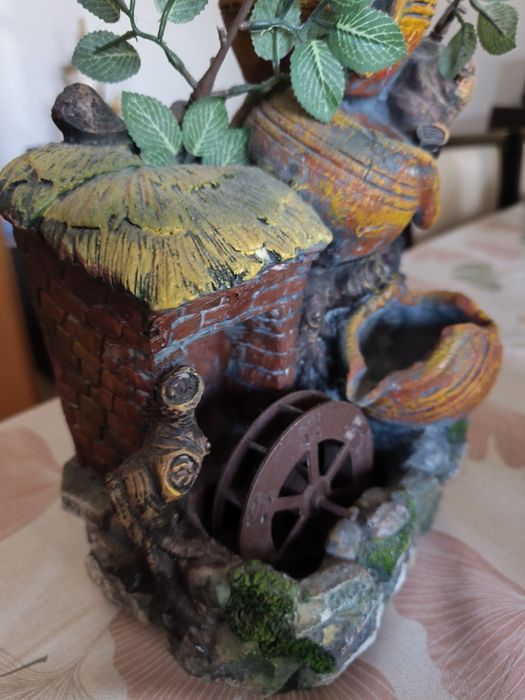 Fonte decorativa elétrica com água