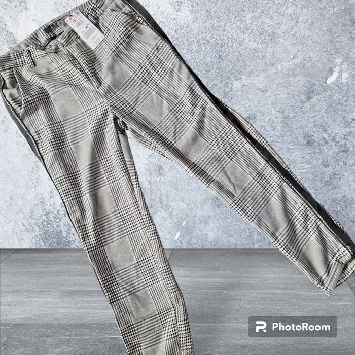 Nowe z metką spodnie w kratkę Reserved 38