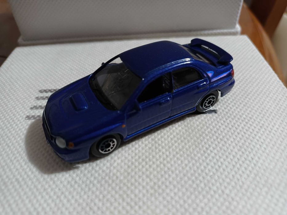 Miniaturas 1/64 Welly CM