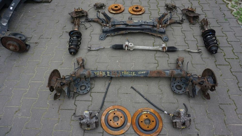 ZACISK TARCZA ZAWIESZENIE TOYOTA YARIS II 1.3 VVTI