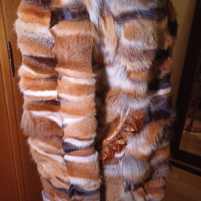 Casaco de peles e penas verdadeiras