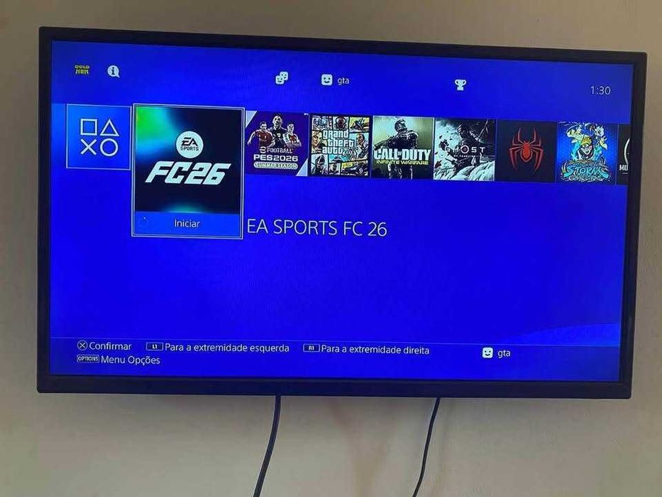 PS4 Slim 1TB Desbloqueada + GTA 5 + FC26 + RD2 + 1 Comando Novo + Cabo