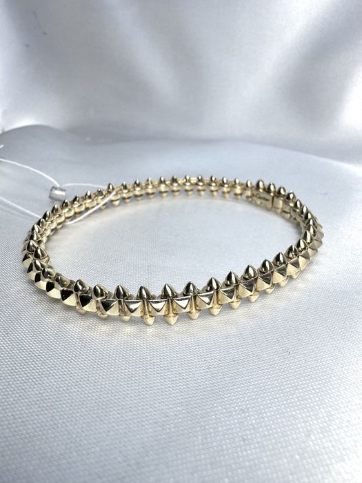 Золотий браслет у стилі Cartier