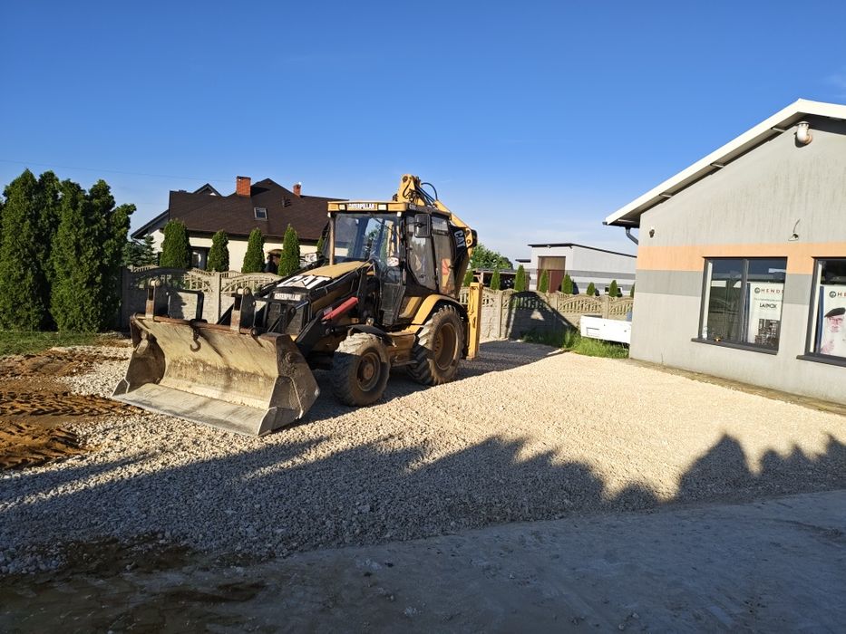 Prace ziemne/Wykopy/Usługi Koparko-ładowarką/Szambo/Wyburzenia/Usługi Brukarskie/ Układanie kostki/ Zakładanie trawników