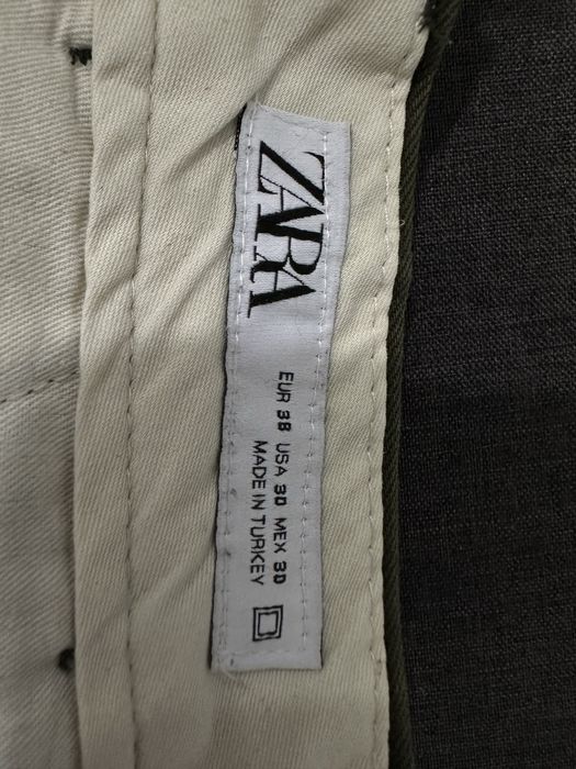 Оливкові брюки Zara