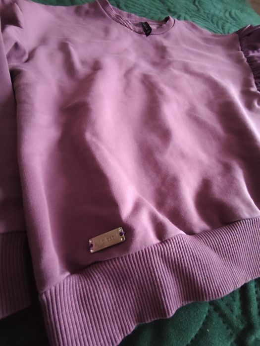 Bluza dziewczęca z ozdobną falbaną r 146