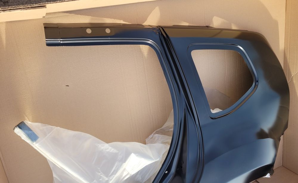 Dacia Duster I 1 błotnik tylny lewy poszycie