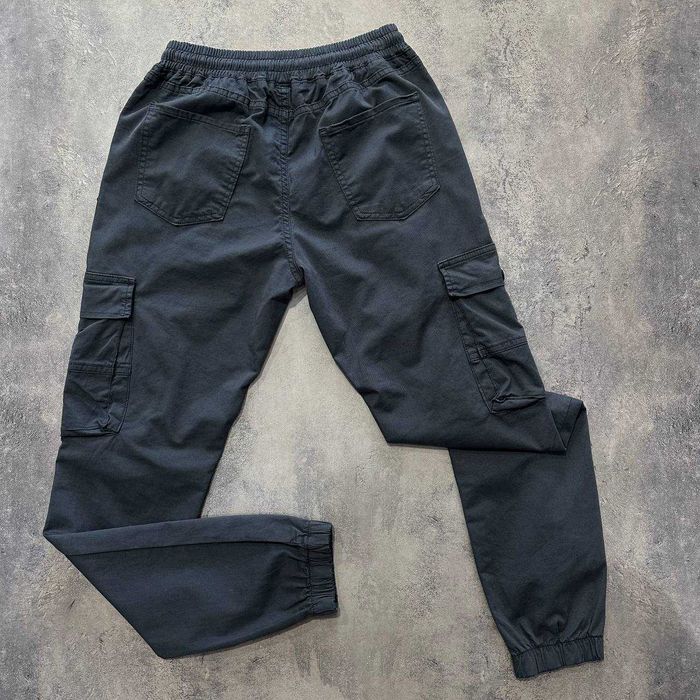 Сірі чолвоічі штани карго Stone Island