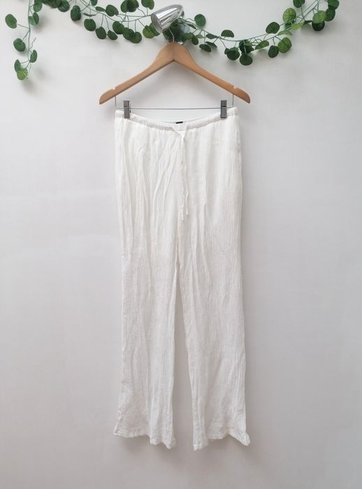 Calças Brancas de tecido fino