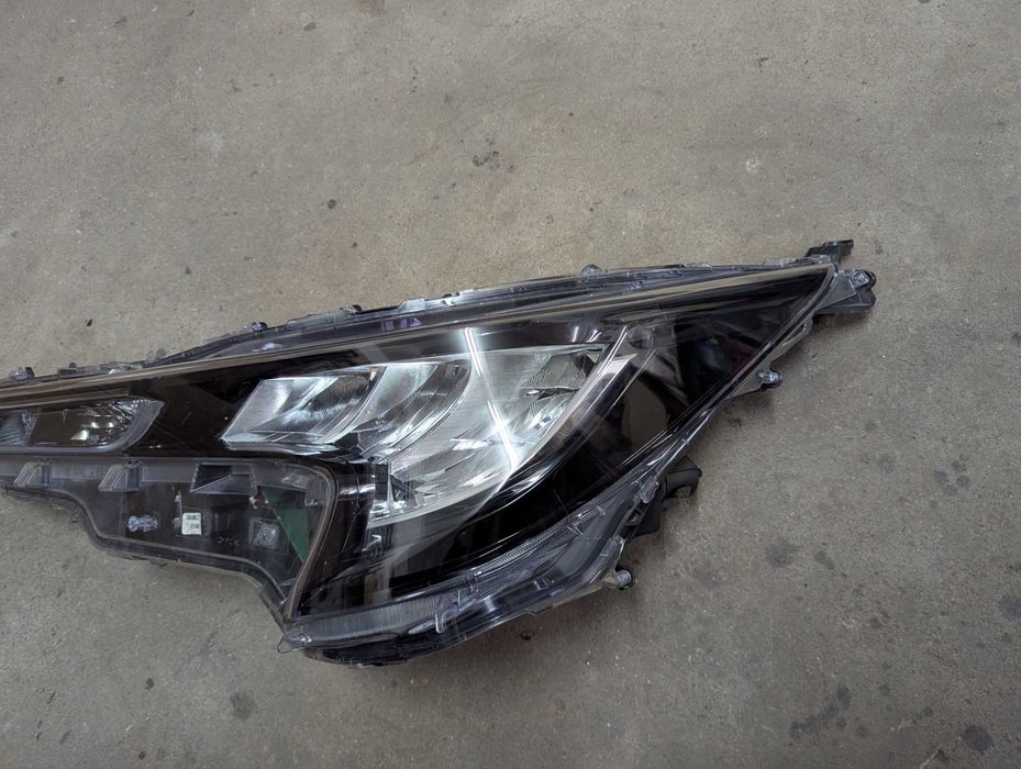 Farol/Ótica esquerda Toyota Corolla e21