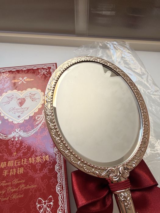 Flower knows  Handheld Mirror