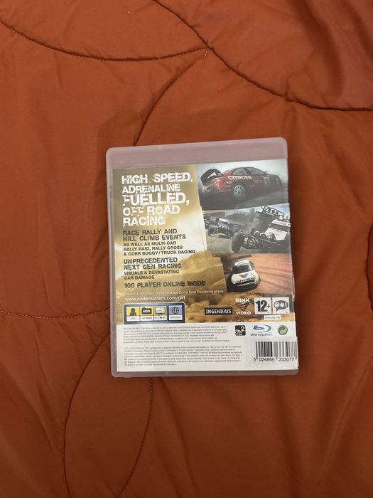caixa com a capa e o manual do colin mcrae dirt