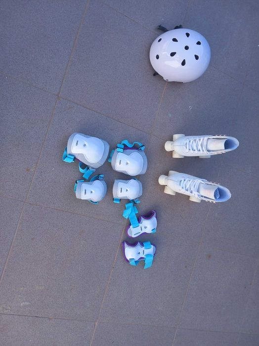 Patins 36 + capacete + protecoes xs + saco