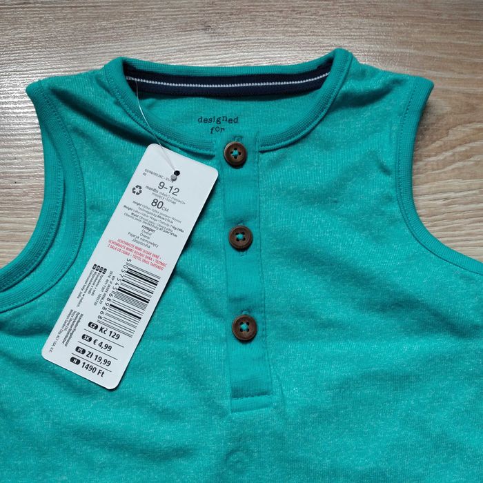 Srzedam NOWY rampers bez rękawów body roz.80cm