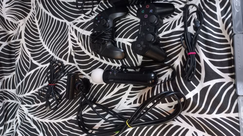 PS3 z 14 płytami i kierownicą gratis!