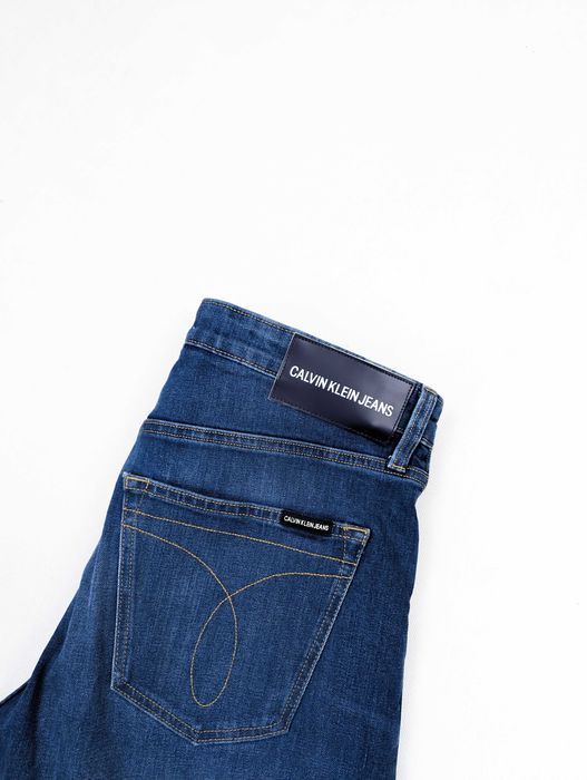 Calvin Klein niebieskie spodnie jeansy 33x32 L