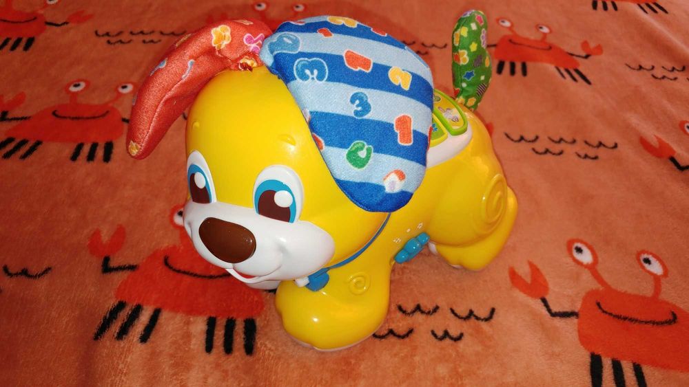 Clementoni jeżdżący piesek Uszatek akuku zabawka interaktywna 10+ 12+