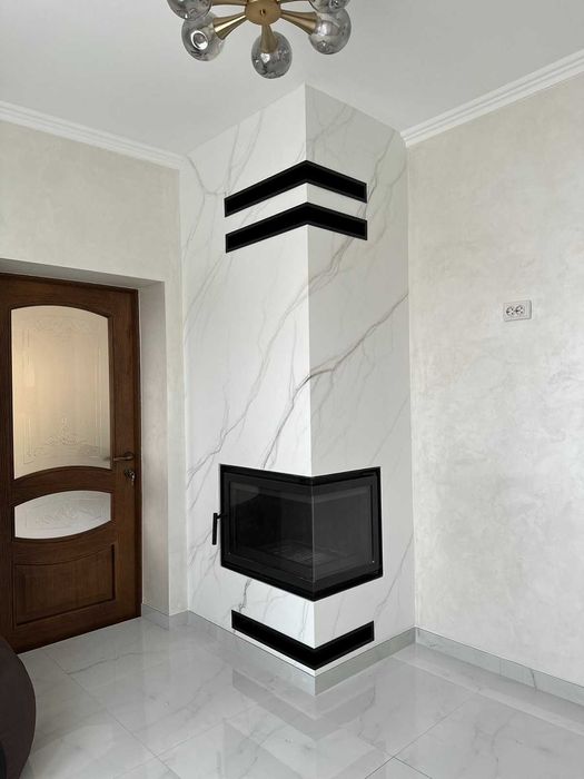 Якісний монтаж каміна з обігрівом на будинок