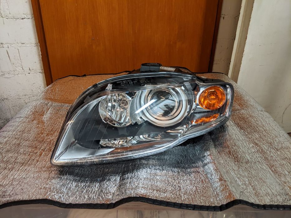 Фара левая Audi A4 B7 11/04-9/06 + Motor elektr D1S Xenon
