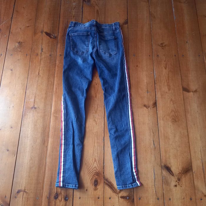 spodnie jeans z lampasami 38 M