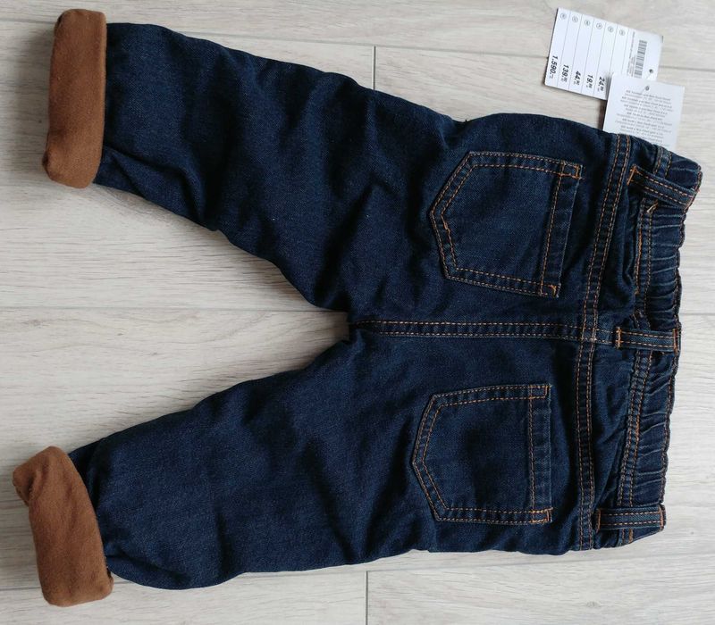 Nowe jeansowe spodnie rozm. 74
