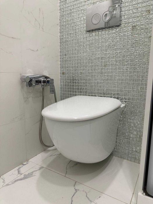 Унітаз підвісний RAK Ceramics Sensation SENWC1446AWHA з кришкою