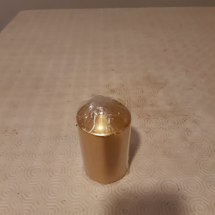 Vela decorativa dourada