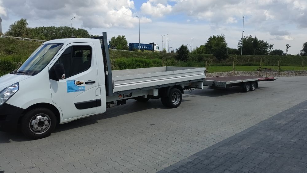 Transport usługi tran przewóz towarów rzeczy laweta platforma  dłużyca