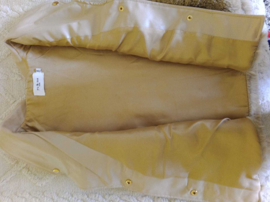 Colete You e Me Paris, muito bem cuidado.