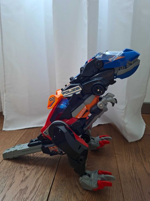 Dinozaur Transformer VTech Switch & Go Mega T-Rex 3w1 Niemiecki