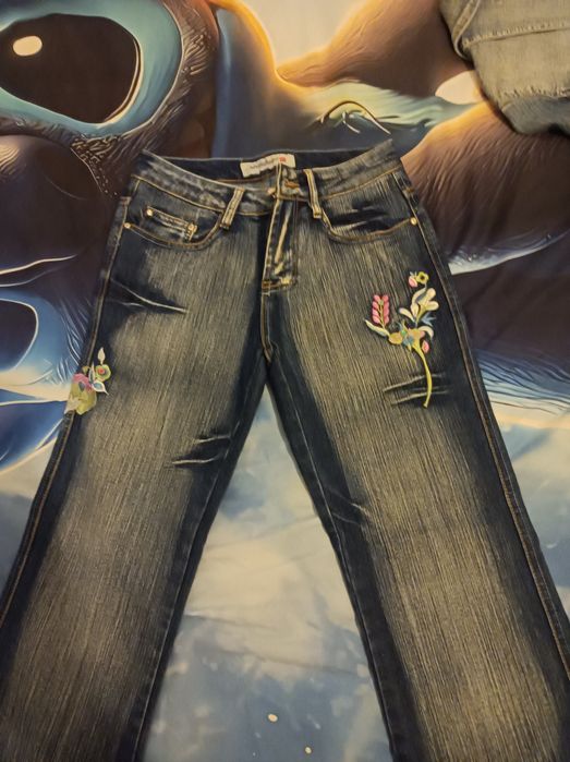 Calças de ganga trabalhadas