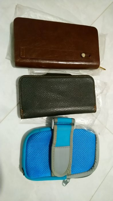 Гаманці кошельки для денег и тел.