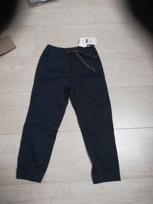 Nowe spodnie 110 Smyk dla chłopca granatowe