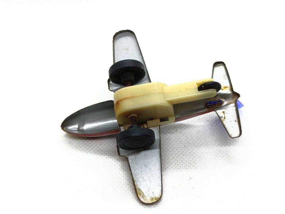 Avião brinquedo antigo em lata de fricção TX 171