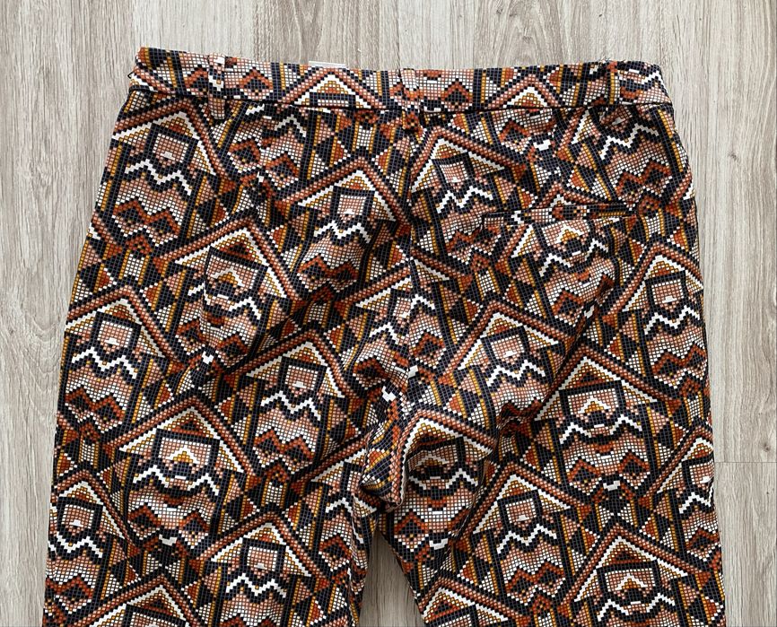 Wzorzyste spodnie H&M aztecki wzór brąz pomarańcz 42 xl jak nowe