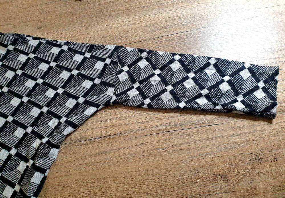 Casaco preto e branco da marca Sucre et Sel