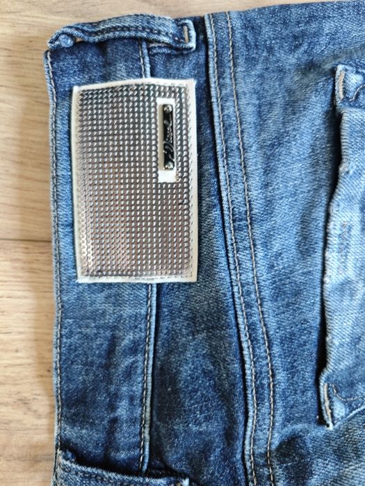 Damskie spodnie Diesel rozmiar E27 L32