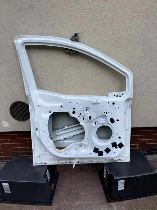 Ford transit courier MK2 drzwi lewe przód OE