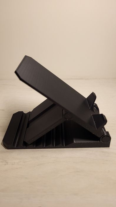 Підставка для телефона з регулюванням положення