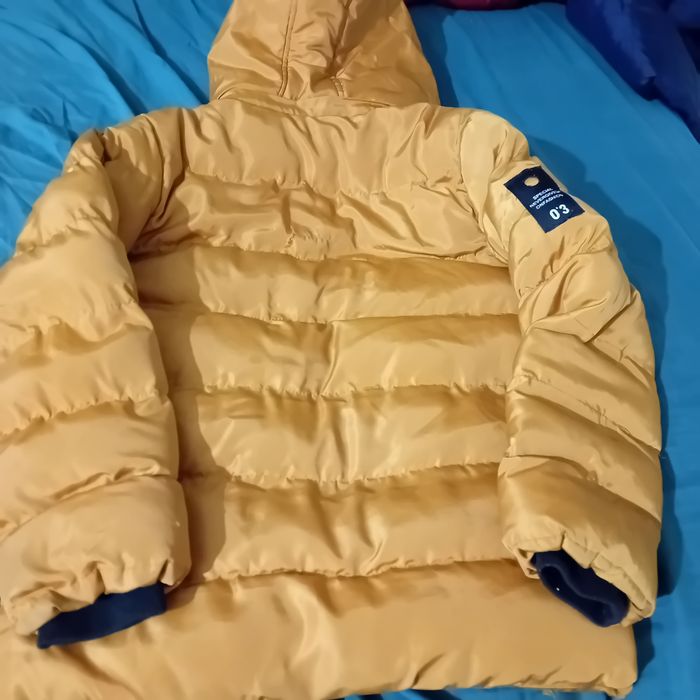 Ruda ciepła kurtka na 140 cm