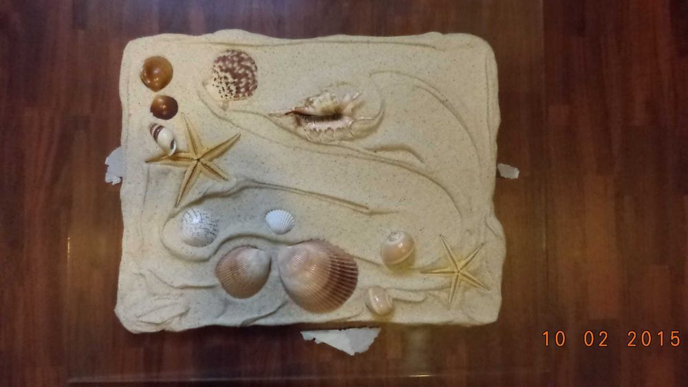 Quadro decorativo com motivos de praia em relevo