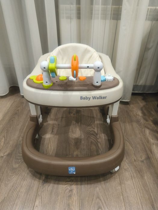 Дитячі ходунки коричневого кольору