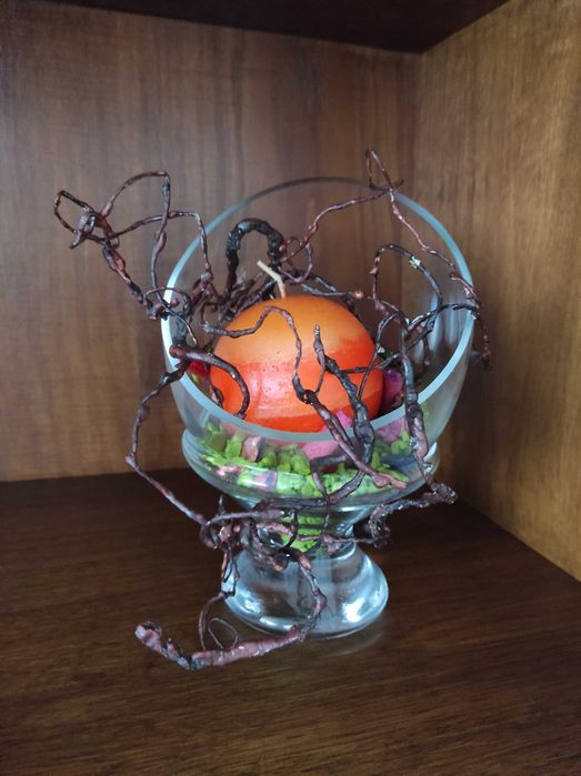 Vela decorativa em suporte de vidro