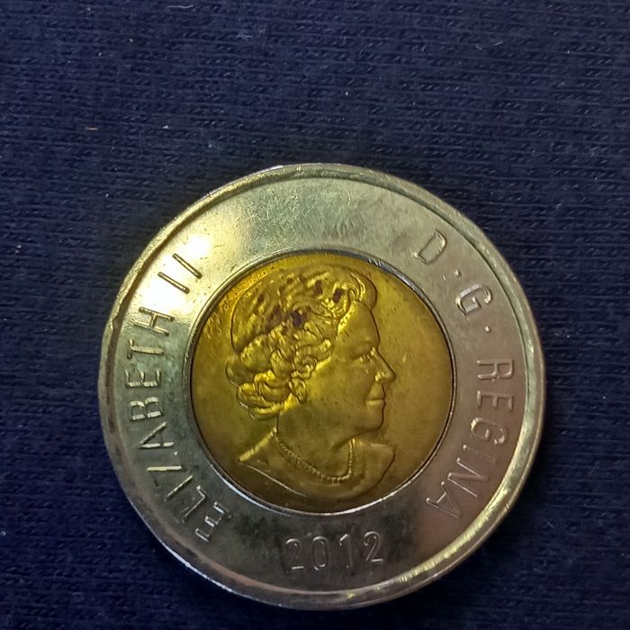 Moedas dólar Canadá e liras Itália
