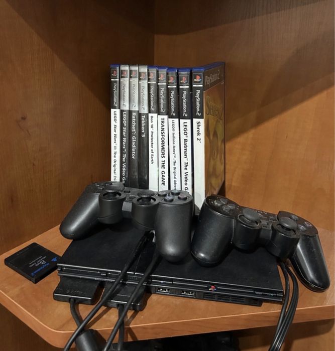 Konsola Sony Playstation 2 + pady + zestaw gier + karta pamięci + przejściówka