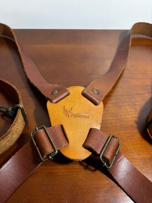 Arnês para binóculos