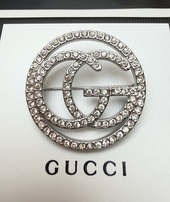 Broszka Gucci srebrna z cyrkoniami