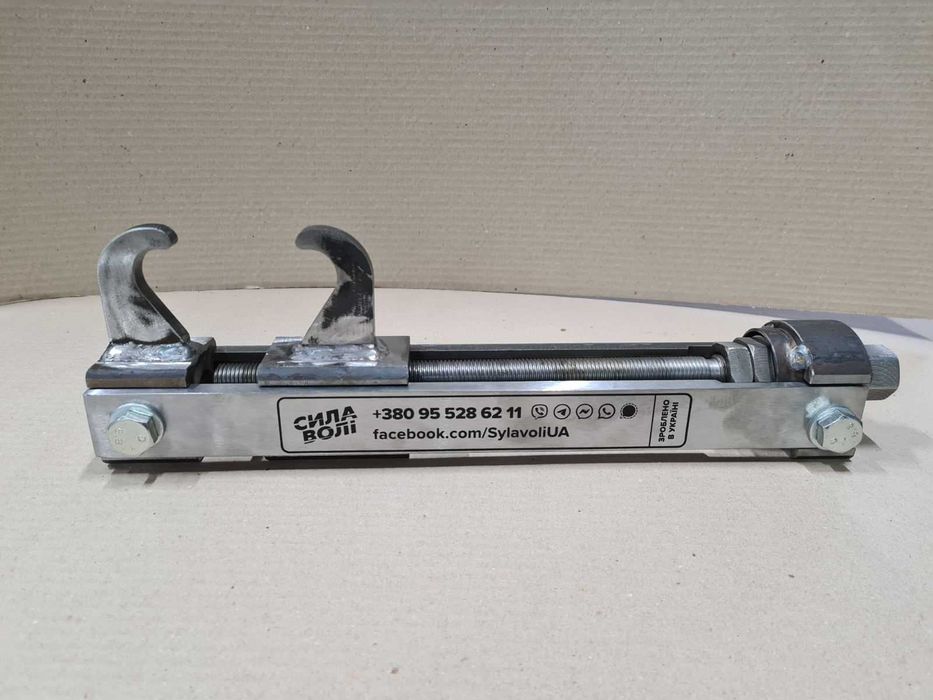 Пристрій для стягування гусениць