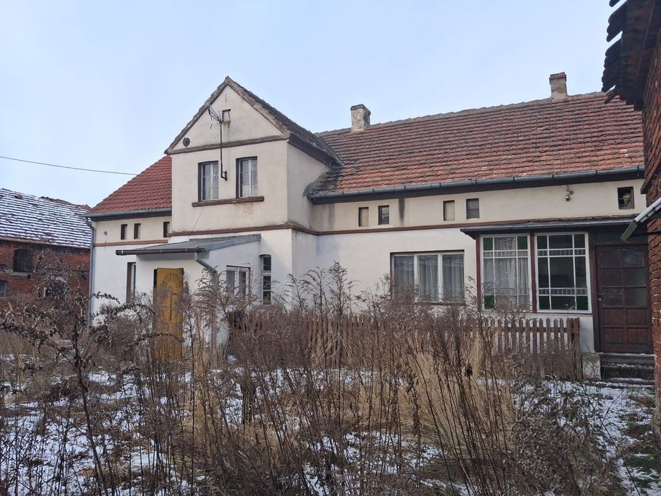 Nieruchomość ( ziemia z budynkami)